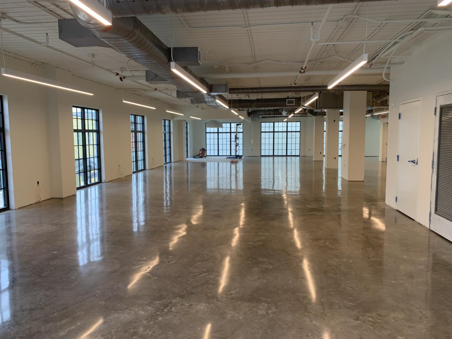 Polished Concrete project by Concrete Ideas Florida: Polished concrete floor with consistent sheen and reflective finish.