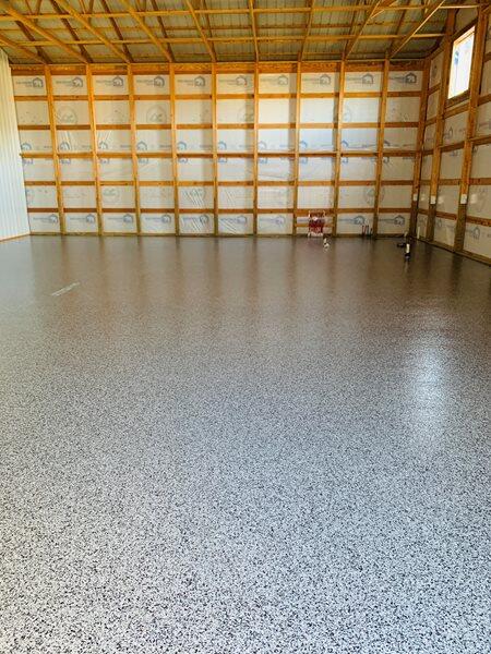 Epoxy Flooring project by Concrete Ideas Florida: High-gloss epoxy floor with reflective finish and seamless surface.