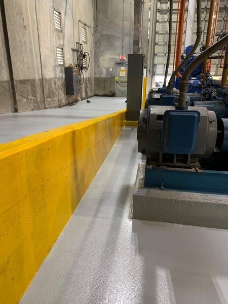 Epoxy Flooring project by Concrete Ideas Florida: Industrial epoxy floor with safety striping and durable protective coating.