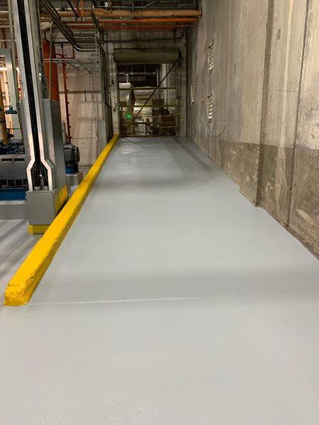 Epoxy Flooring project by Concrete Ideas Florida: Epoxy floor coating in a garage or workshop with a clean, finished look.