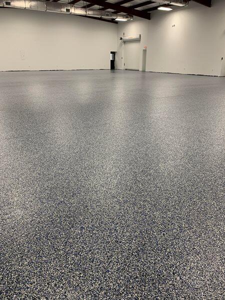 Epoxy Flooring project by Concrete Ideas Florida: Industrial epoxy floor with safety striping and durable protective coating.