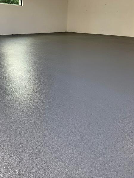 Epoxy Flooring project by Concrete Ideas Florida: Epoxy floor coating in a garage or workshop with a clean, finished look.