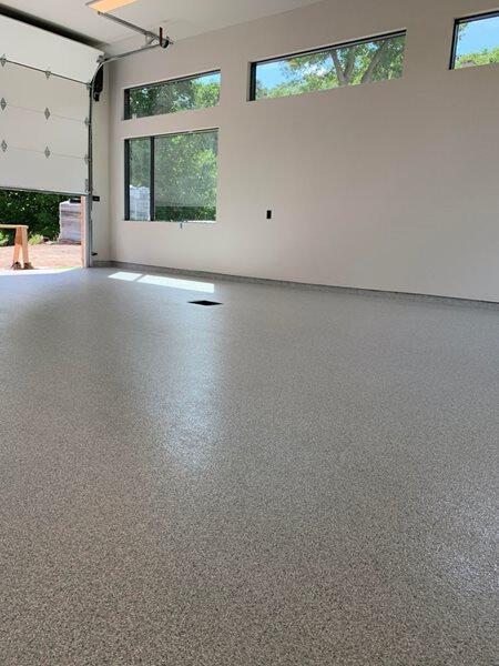 Epoxy Flooring project by Concrete Ideas Florida: High-gloss epoxy floor with reflective finish and seamless surface.