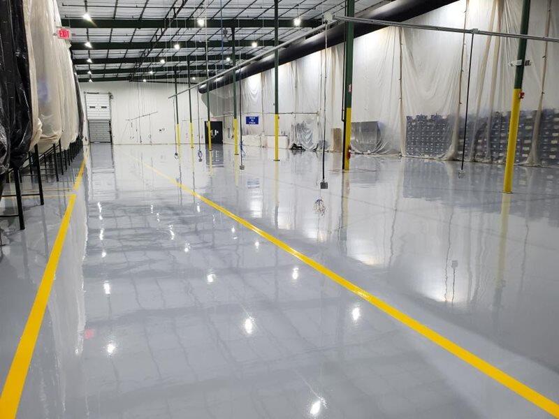 Epoxy Flooring project by Concrete Ideas Florida: Industrial epoxy floor with safety striping and durable protective coating.