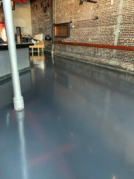 Epoxy Flooring project by Concrete Ideas Florida: Decorative flake epoxy system with broadcast chip texture and clear topcoat.