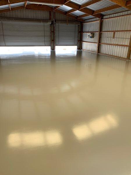 Epoxy Flooring project by Concrete Ideas Florida: High-gloss epoxy floor with reflective finish and seamless surface.