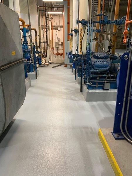Epoxy Flooring project by Concrete Ideas Florida: High-gloss epoxy floor with reflective finish and seamless surface.