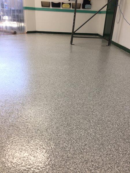 Epoxy Flooring project by Concrete Ideas Florida: Decorative flake epoxy system with broadcast chip texture and clear topcoat.