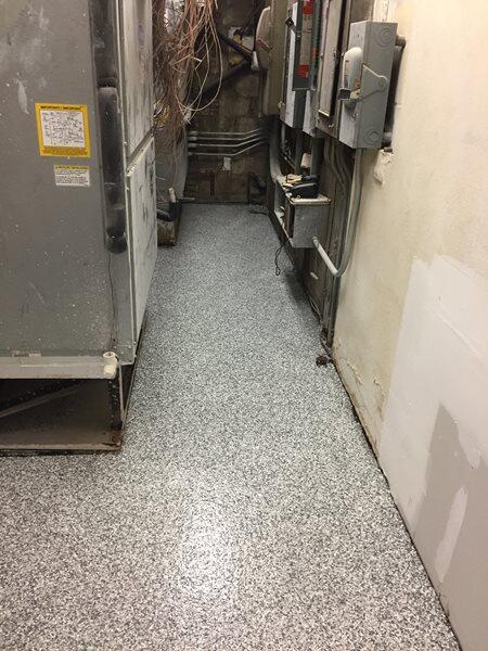 Epoxy Flooring project by Concrete Ideas Florida: Epoxy floor coating in a garage or workshop with a clean, finished look.