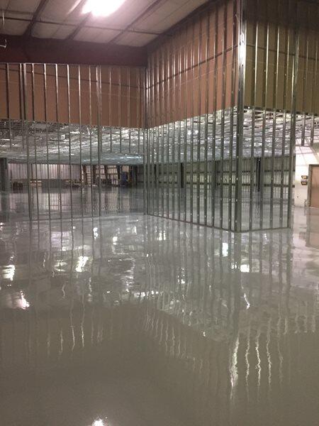Epoxy Flooring project by Concrete Ideas Florida: Decorative flake epoxy system with broadcast chip texture and clear topcoat.