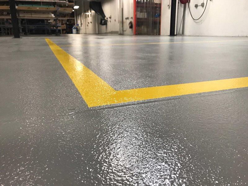 Epoxy Flooring project by Concrete Ideas Florida: Industrial epoxy floor with safety striping and durable protective coating.