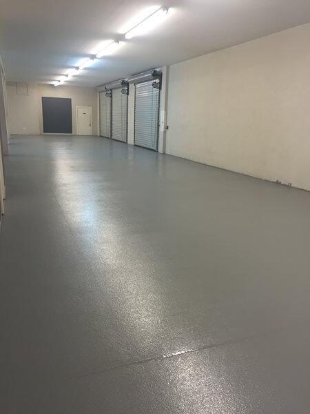 Epoxy Flooring project by Concrete Ideas Florida: Decorative flake epoxy system with broadcast chip texture and clear topcoat.