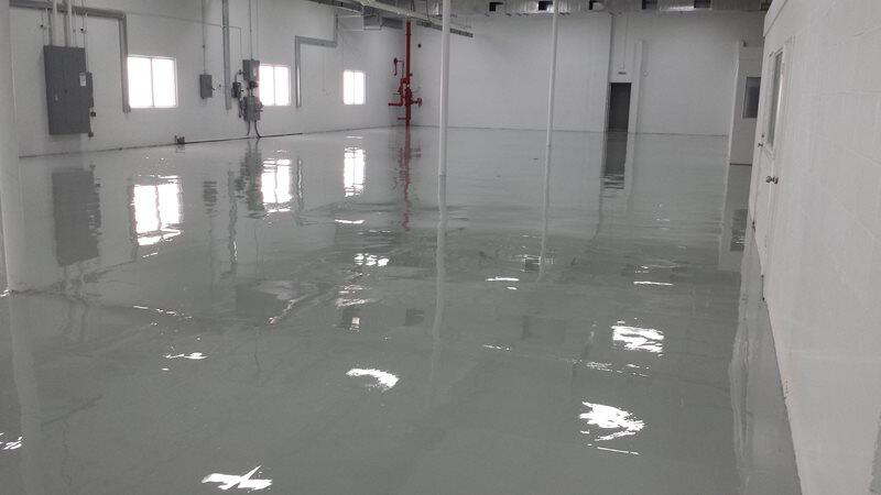 Epoxy Flooring project by Concrete Ideas Florida: Epoxy floor coating in a garage or workshop with a clean, finished look.