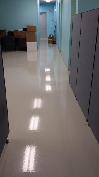 Epoxy Flooring project by Concrete Ideas Florida: High-gloss epoxy floor with reflective finish and seamless surface.