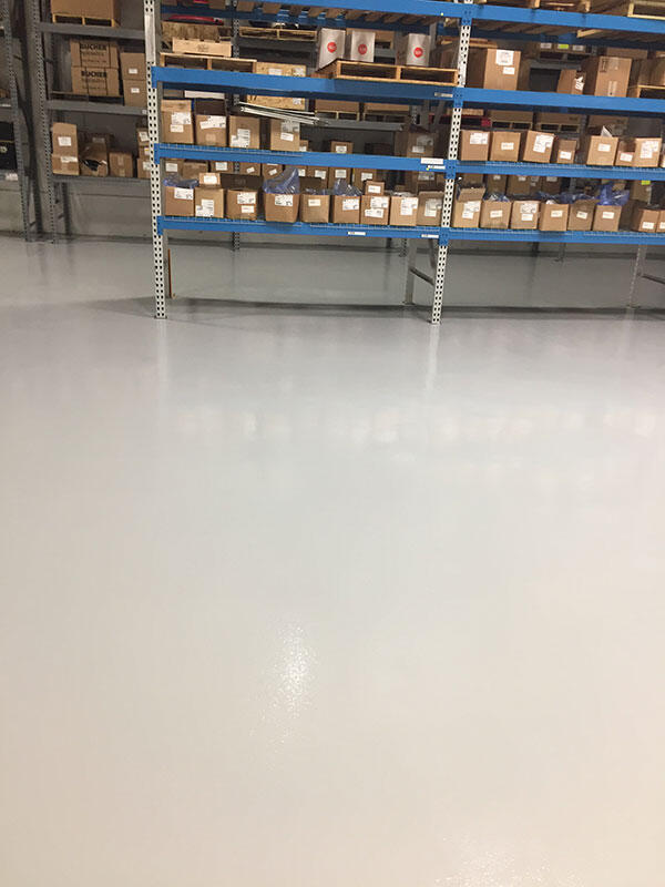Epoxy Flooring project by Concrete Ideas Florida: Industrial epoxy floor with safety striping and durable protective coating.