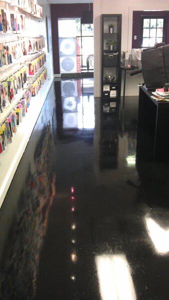 Epoxy Flooring project by Concrete Ideas Florida: Decorative flake epoxy system with broadcast chip texture and clear topcoat.