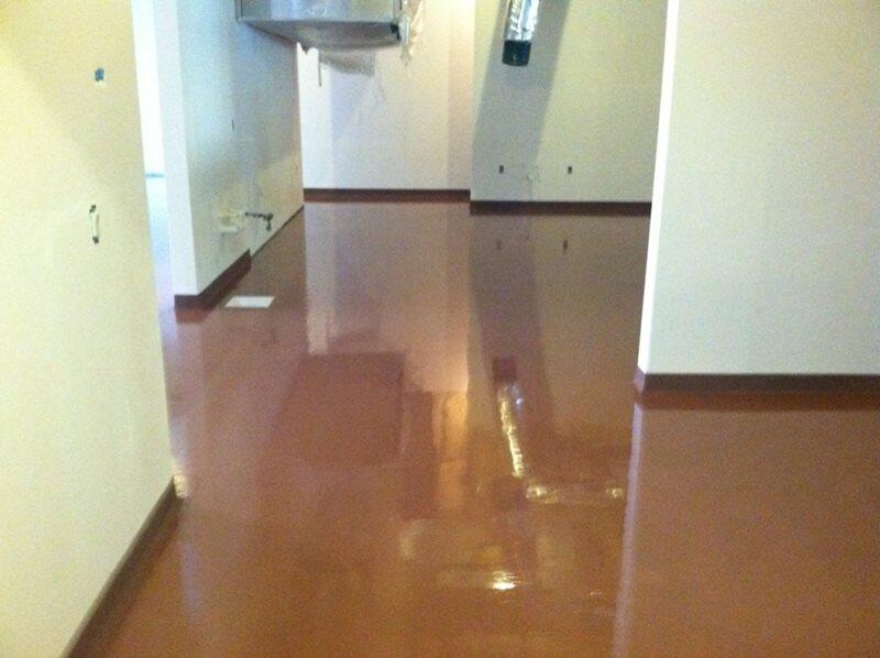 Epoxy Flooring project by Concrete Ideas Florida: High-gloss epoxy floor with reflective finish and seamless surface.