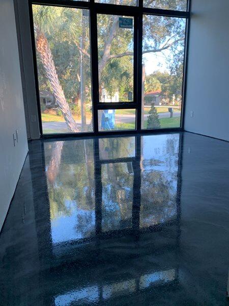 Metallic Epoxy project by Concrete Ideas Florida: Metallic epoxy floor with swirling color movement and high-gloss depth.