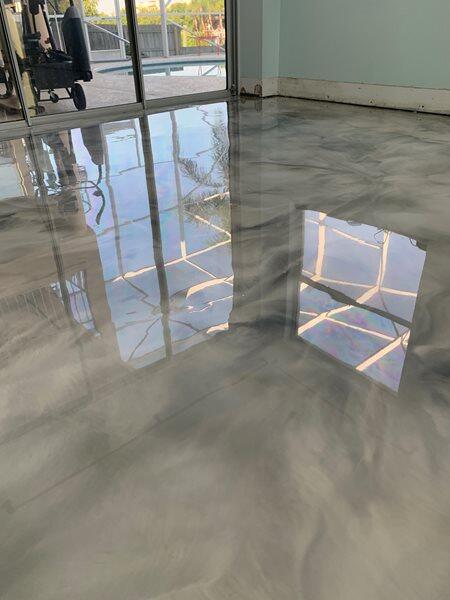 Metallic Epoxy project by Concrete Ideas Florida: Metallic epoxy garage floor with showroom-quality finish.