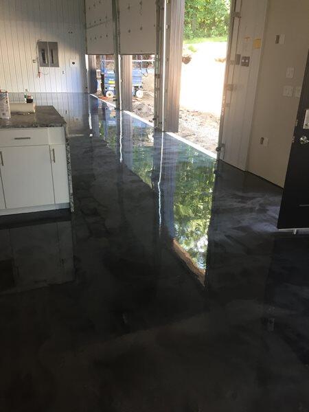 Metallic Epoxy project by Concrete Ideas Florida: High-gloss metallic epoxy finish with reflective surface and color variation.