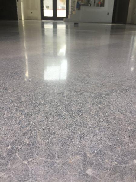 Polished Concrete project by Concrete Ideas Florida: Polished concrete interior with warm reflections and smooth surface.